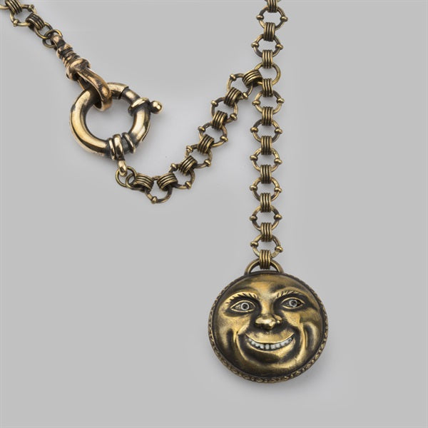 a hand made fob watch with a moon face made in brass with a hand made chain hanging down. All made for danny de vito to wear in the film dumbo. Made by stephen einhorn